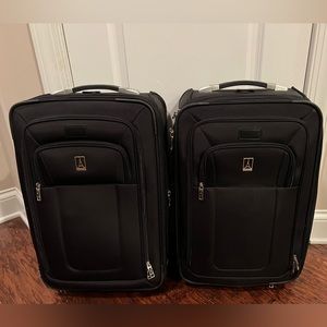 Two (2) Travelpro 22” Crew 8 Expandable Rollaboard Suitcases